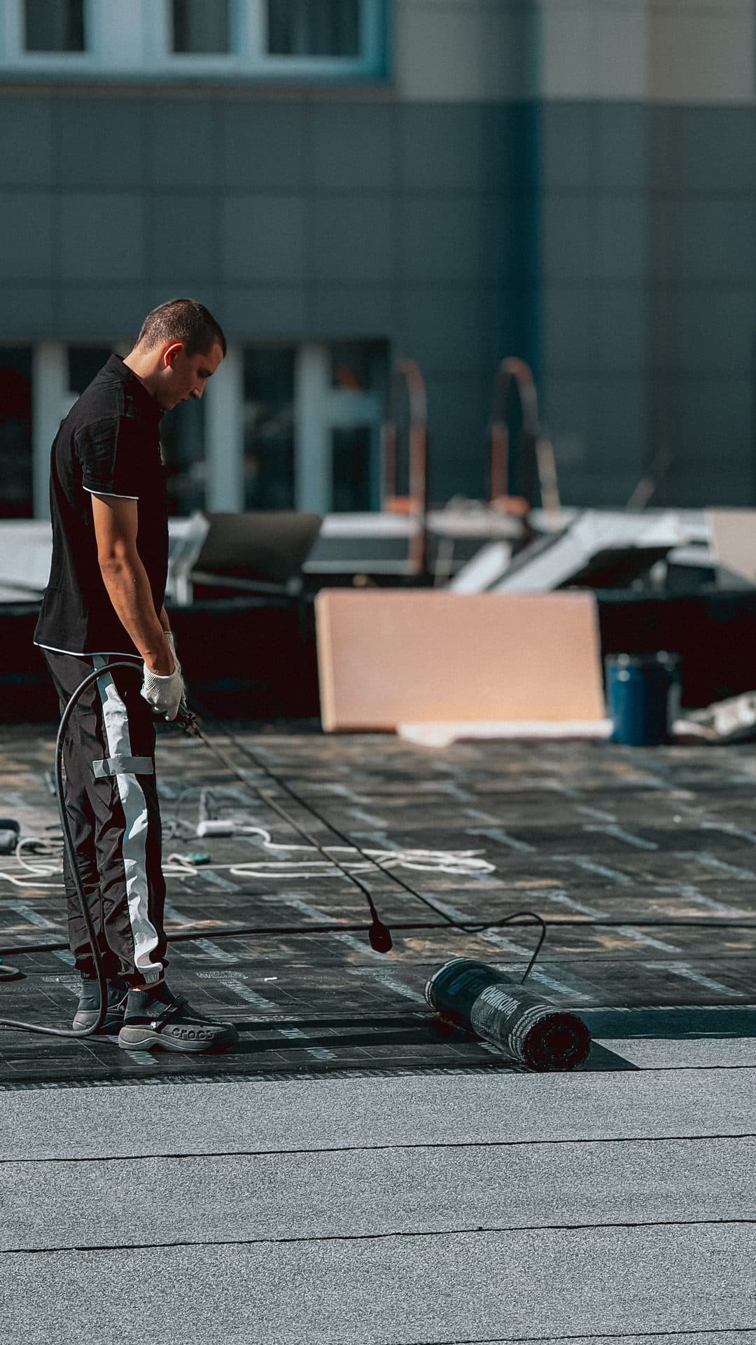 Modified bitumen (torch-down) roofing application on a flat roof